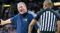 Huggins never resigned from WVU, attorney says