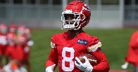 Former Clemson wide receiver Justyn Ross exits training camp practice on cart